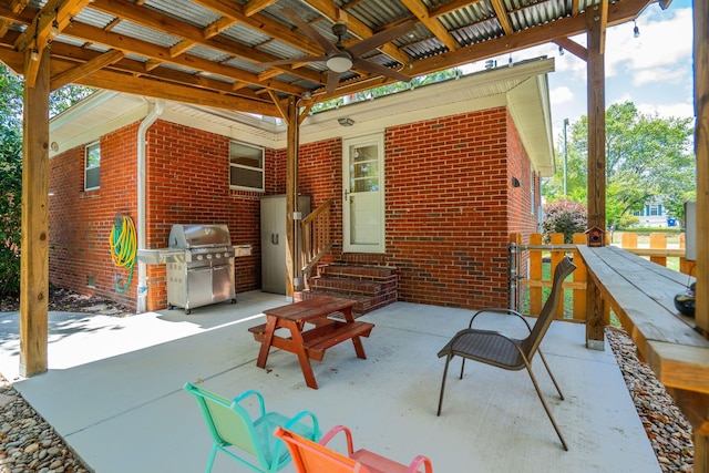 view of patio with a ceiling fan, grilling area, and entry steps