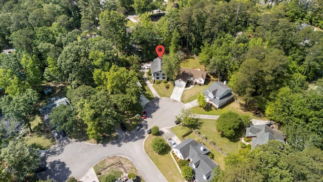 bird's eye view featuring a residential view and a forest view