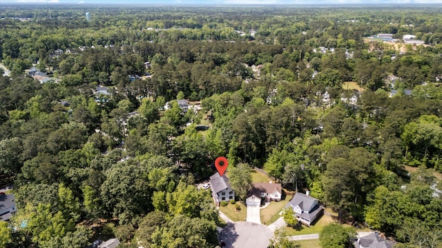 drone / aerial view featuring a view of trees
