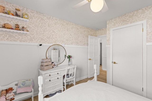 bedroom with hardwood / wood-style flooring and ceiling fan