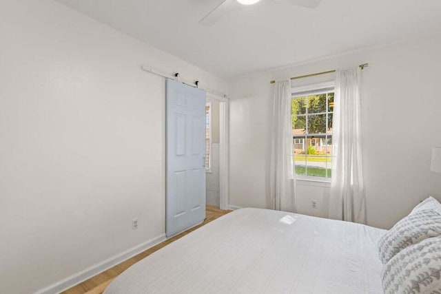 bedroom featuring ceiling fan and light wood-type flooring