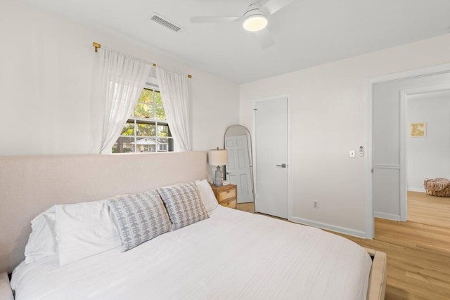 bedroom featuring wood-type flooring and ceiling fan