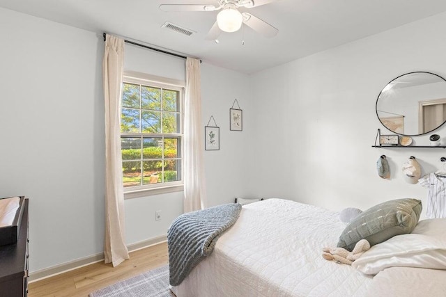 bedroom featuring light hardwood / wood-style flooring and ceiling fan