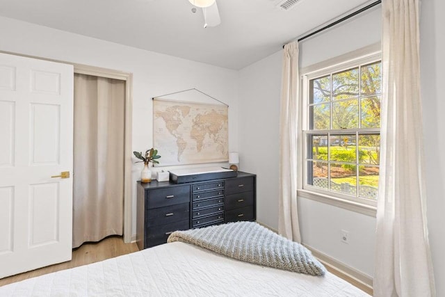 bedroom featuring ceiling fan and light hardwood / wood-style floors