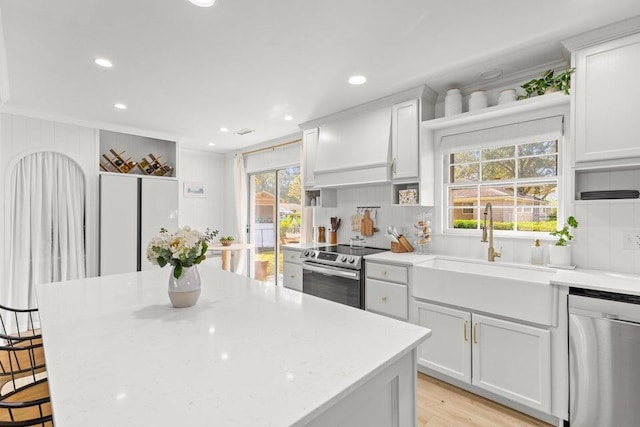 kitchen featuring white cabinetry, appliances with stainless steel finishes, and sink