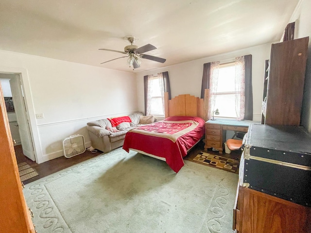 bedroom with ceiling fan and hardwood / wood-style floors