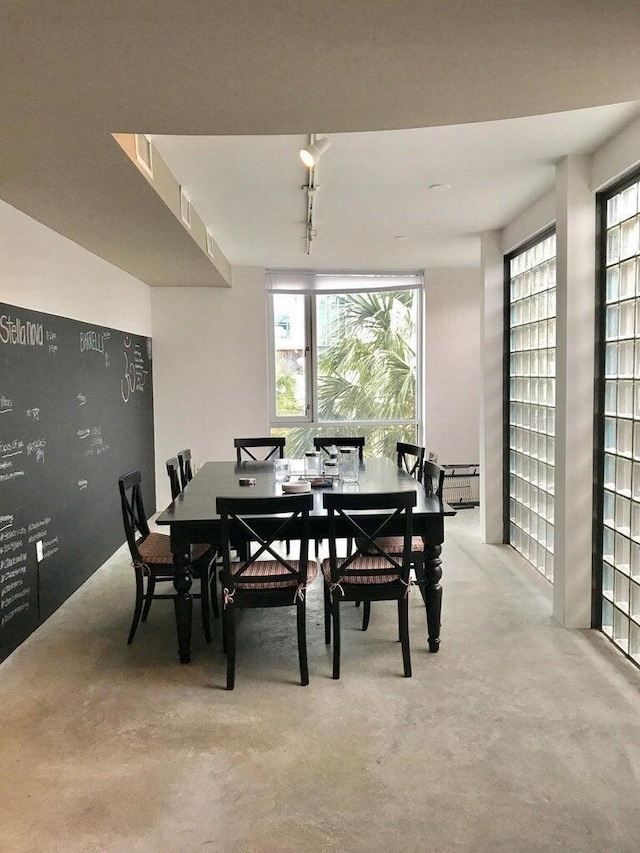 dining room featuring concrete flooring