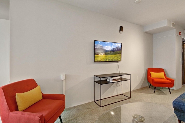 living area with visible vents and carpet floors