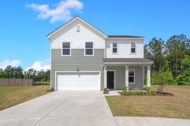 view of front of house with a garage and a front lawn