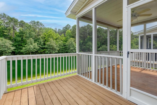 3588 Bagley Dr, Mount Pleasant, SC 29466 - wooden deck with a sunroom, a lawn, and a ceiling fan