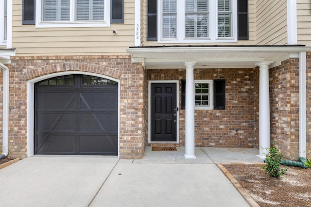 3588 Bagley Dr, Mount Pleasant, SC 29466 - property entrance featuring a garage, concrete driveway, and brick siding
