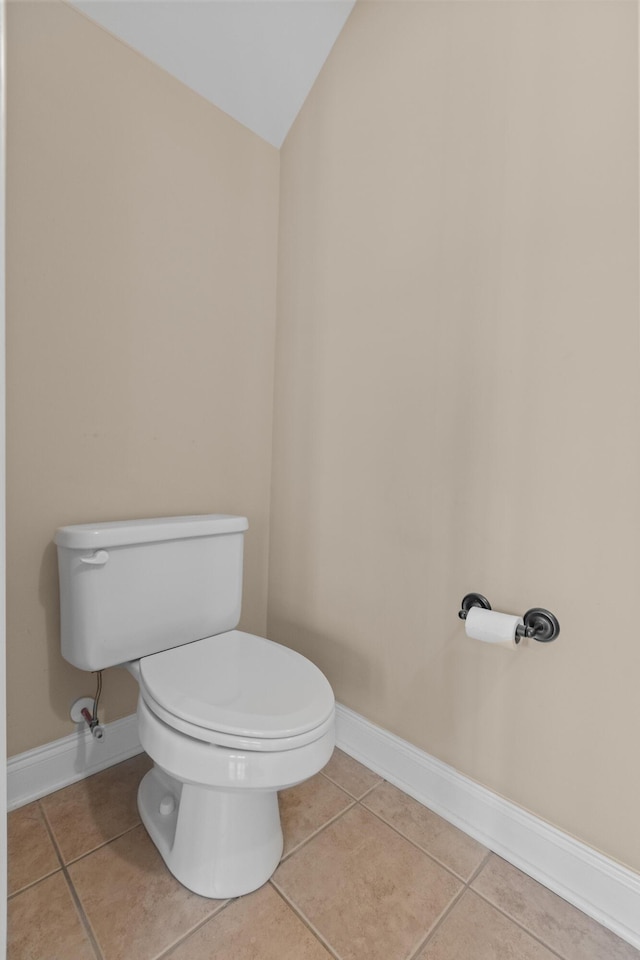 3588 Bagley Dr, Mount Pleasant, SC 29466 - bathroom featuring toilet, tile patterned floors, baseboards, and vaulted ceiling