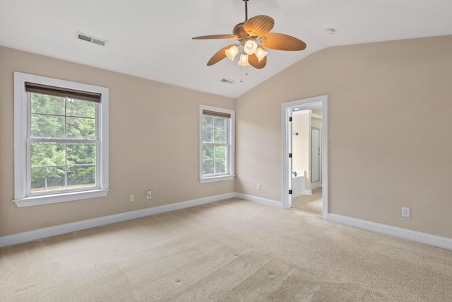 3588 Bagley Dr, Mount Pleasant, SC 29466 - unfurnished room with healthy amount of natural light, vaulted ceiling, light carpet, ceiling fan, and baseboards