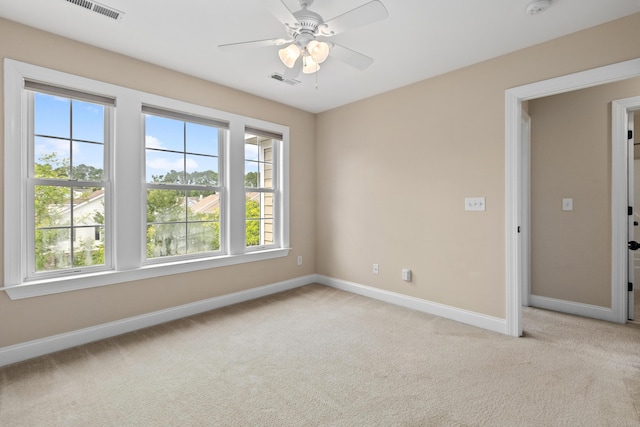 3588 Bagley Dr, Mount Pleasant, SC 29466 - empty room featuring light colored carpet, plenty of natural light, baseboards, and ceiling fan