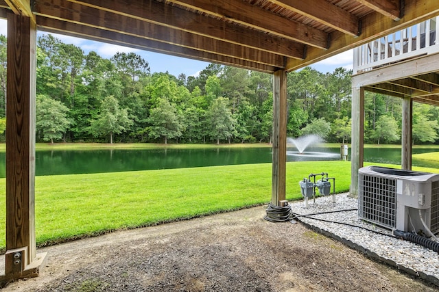 3588 Bagley Dr, Mount Pleasant, SC 29466 - view of green lawn with central AC, a water view, and view of scattered trees