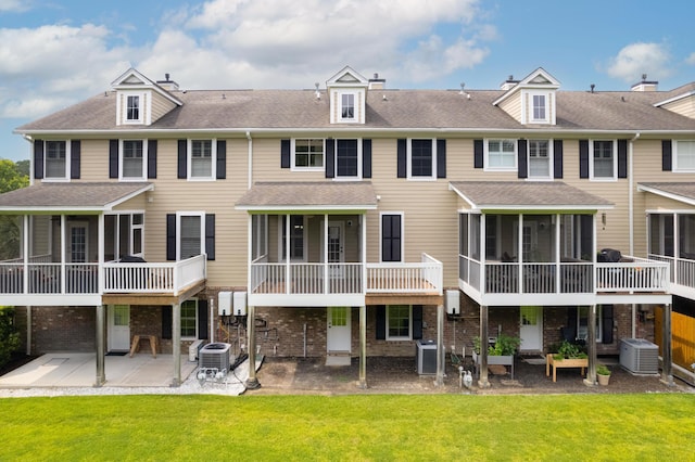 3588 Bagley Dr, Mount Pleasant, SC 29466 - rear view of property featuring a sunroom, central AC unit, and a patio