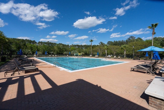3588 Bagley Dr, Mount Pleasant, SC 29466 - community pool featuring a patio area and view of scattered trees