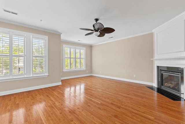 3588 Bagley Dr, Mount Pleasant, SC 29466 - unfurnished living room with baseboards, light wood-type flooring, a ceiling fan, and crown molding