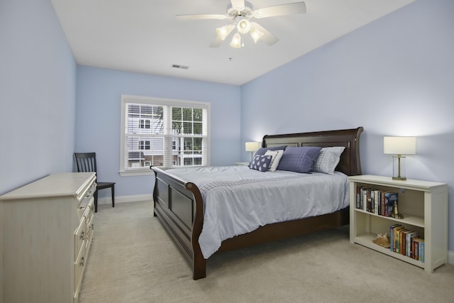 bedroom featuring light carpet, baseboards, visible vents, and ceiling fan