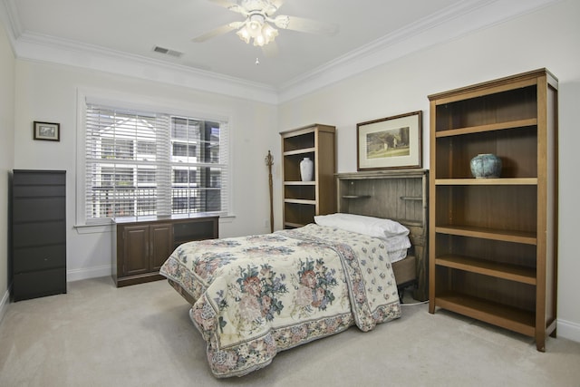 bedroom featuring light colored carpet, crown molding, and baseboards