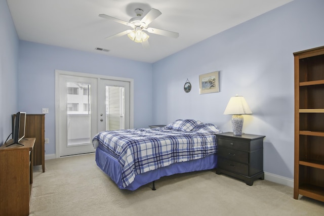 bedroom with carpet floors, french doors, visible vents, and baseboards