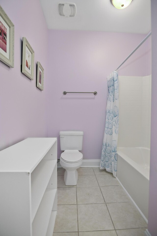 bedroom featuring ceiling fan and ensuite bath