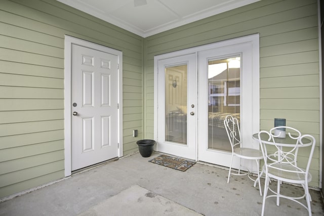 entrance to property featuring a patio area