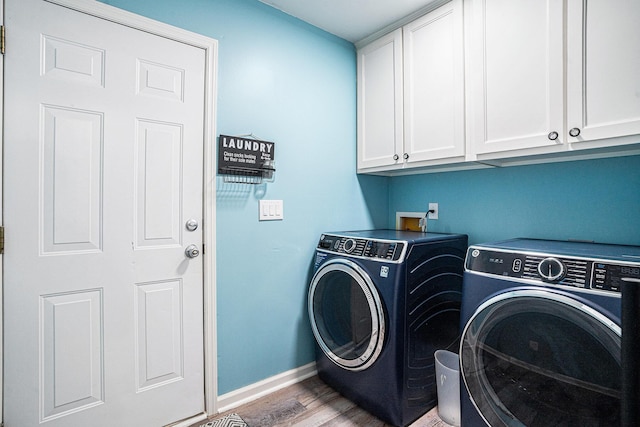 203 Eagle Ridge Rd, Summerville, SC 29485 - laundry area with baseboards, washing machine and dryer, cabinet space, and wood finished floors