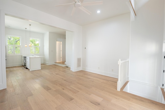 173 Coming St Unit B, Charleston, SC 29403 - unfurnished room featuring light wood-style floors, a ceiling fan, and recessed lighting