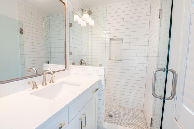 173 Coming St Unit B, Charleston, SC 29403 - bathroom with vanity, a shower stall, and tile walls