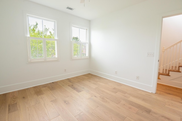 173 Coming St Unit B, Charleston, SC 29403 - unfurnished room with stairs, light wood-style floors, and ceiling fan