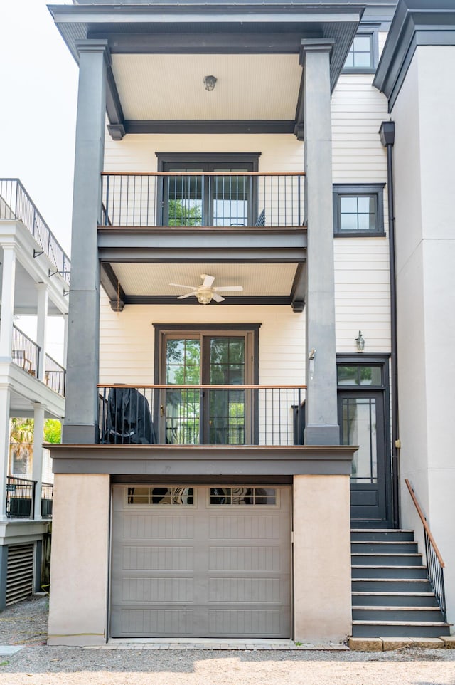 173 Coming St Unit B, Charleston, SC 29403 - rear view of property featuring a balcony, an attached garage, ceiling fan, and driveway