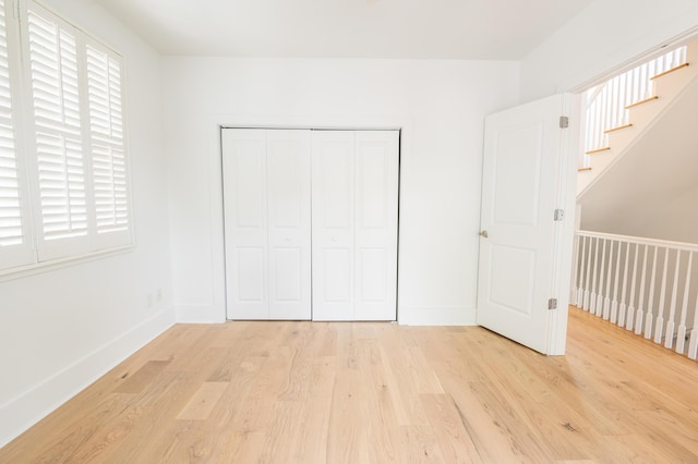 173 Coming St Unit B, Charleston, SC 29403 - unfurnished bedroom featuring light wood-style floors and a closet