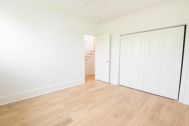 173 Coming St Unit B, Charleston, SC 29403 - unfurnished bedroom featuring light wood-type flooring, a closet, and a ceiling fan