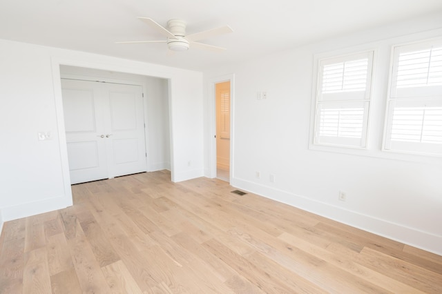 173 Coming St Unit B, Charleston, SC 29403 - unfurnished bedroom with light wood-type flooring, a closet, and ceiling fan
