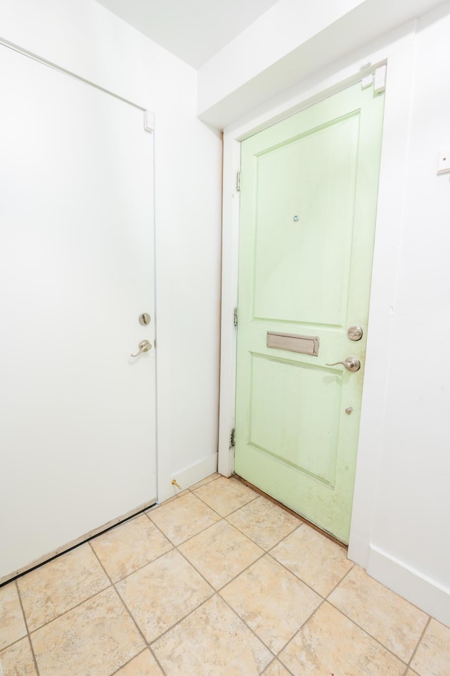 173 Coming St Unit B, Charleston, SC 29403 - doorway with baseboards and light tile patterned floors