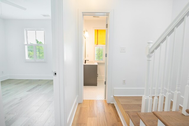 173 Coming St Unit B, Charleston, SC 29403 - corridor with stairway, light wood-type flooring, and healthy amount of natural light