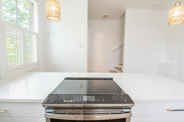 173 Coming St Unit B, Charleston, SC 29403 - kitchen featuring stainless steel electric range oven, a chandelier, and healthy amount of natural light