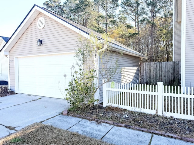 view of property exterior with a garage