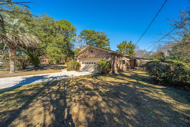 view of property exterior featuring a garage, driveway, and a yard