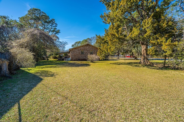 view of yard with fence