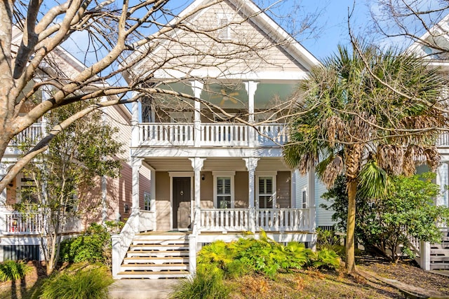 view of front of house with a balcony and covered porch