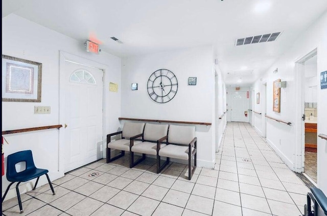 foyer entrance with light tile patterned floors