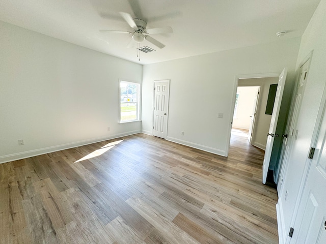 unfurnished bedroom with ceiling fan and light hardwood / wood-style floors