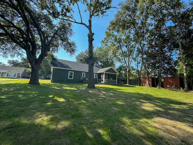 view of yard featuring a sunroom