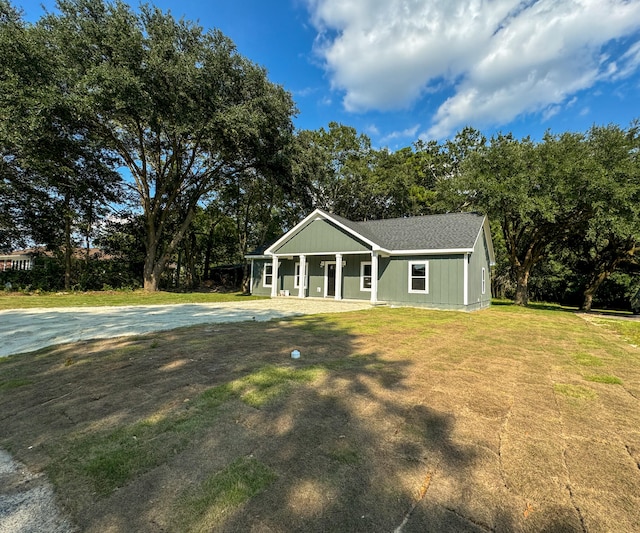 view of front of house with a front lawn and a porch