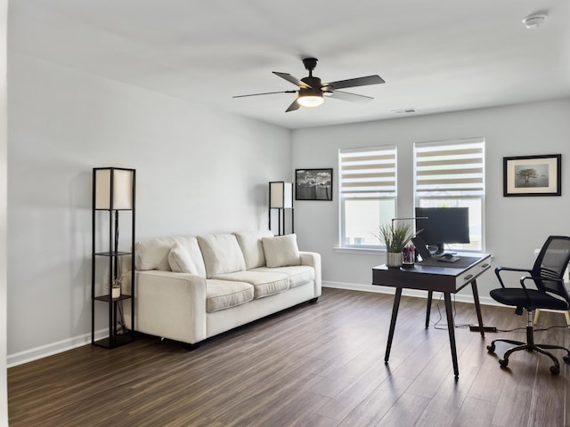 home office featuring baseboards, ceiling fan, and dark wood finished floors
