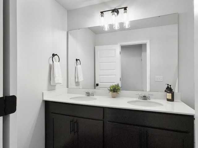 full bath featuring double vanity and a sink