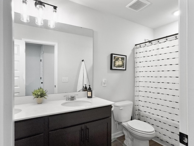 bathroom with a sink, double vanity, toilet, a shower with curtain, and visible vents