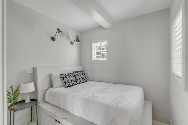 bedroom featuring beamed ceiling